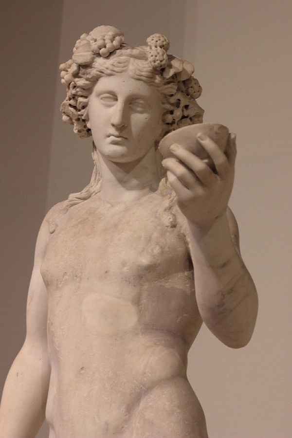 Dionysus, god of wine, Greek statue, 4 century BC.Louvre Museum. Paris, France.