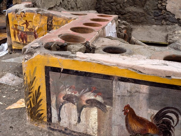 Ruins of a thermopolium, hot food and wine tavern. Pompeii, Italy.