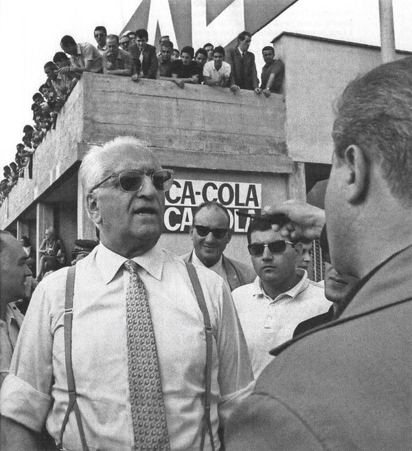 Enzo Ferrari speaks with reporters during the weekend of the 1967 Italian Grand Prix