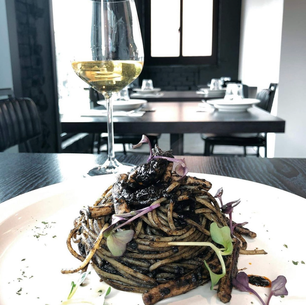 Pasta doused in a dark cuttlefish ink sauce – Typicall Sicilian pasta