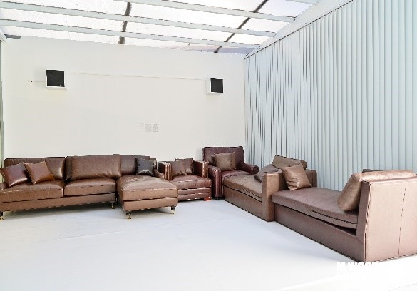 Monument, 2021–2022, Fiberglass mesh print, vintage sofa, and audio loop Variable dimensions, Courtesy the artist"Martin Margiela at M WOODS", Installation View, 2022, M WOODS Hutong, Beijing. Photo by Zhao Yihan, Tian Yu. © MWOODS