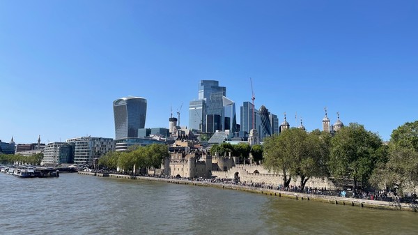 Modern buildings next to the Tower of London on the right