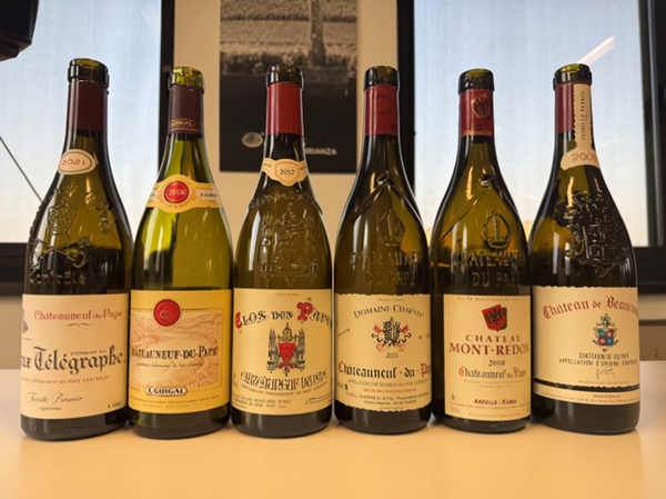 Bottles of Chateauneuf du Pape AOC wines embossed with the traditional papal regalia and insignia. Credits: www.aislombardia.it